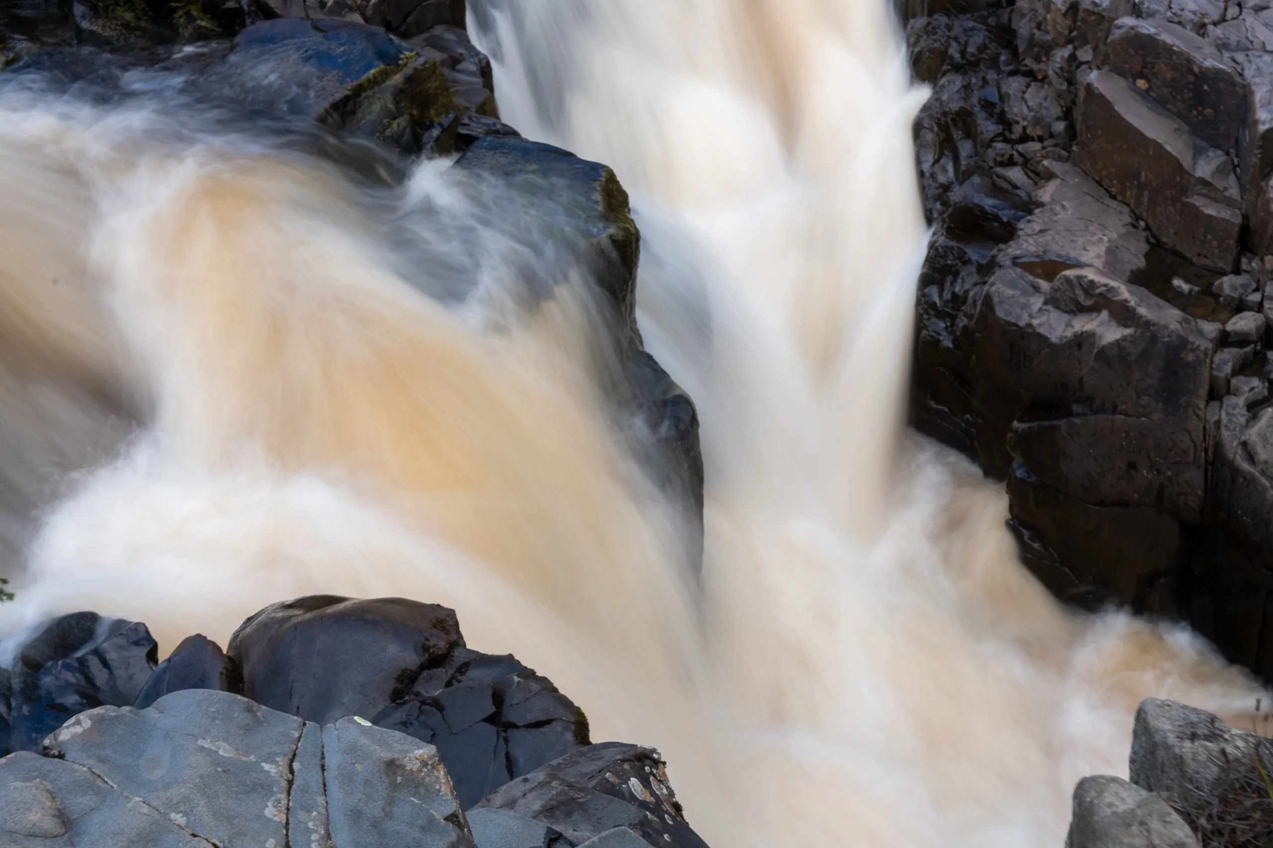 Close-up of waterfall crashing over rocks